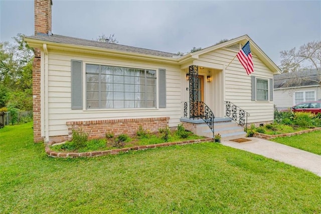 single story home with a front yard