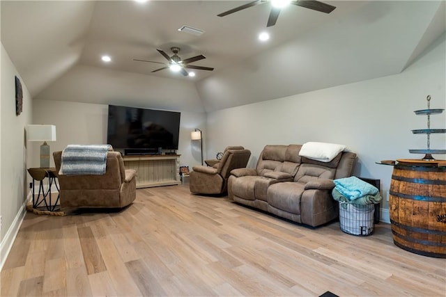 living room with light wood finished floors, vaulted ceiling, ceiling fan, and recessed lighting
