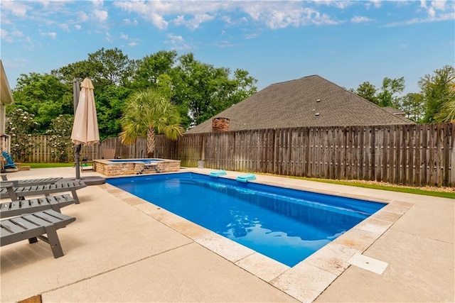 view of pool featuring a patio area, an in ground hot tub, a fenced in pool, and a fenced backyard