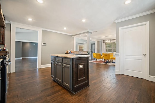 4072 Fenwick Loop, Mobile, AL 36619 - kitchen with crown molding, a kitchen island, recessed lighting, dark wood finished floors, and dark brown cabinets
