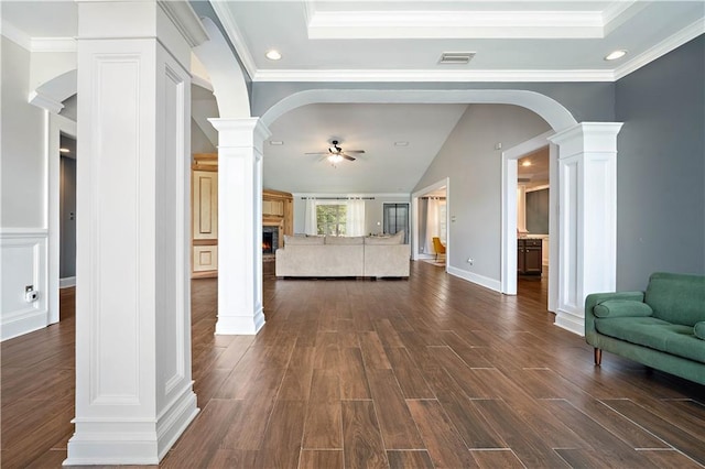 4072 Fenwick Loop, Mobile, AL 36619 - living area with ornate columns, a ceiling fan, arched walkways, a lit fireplace, and recessed lighting