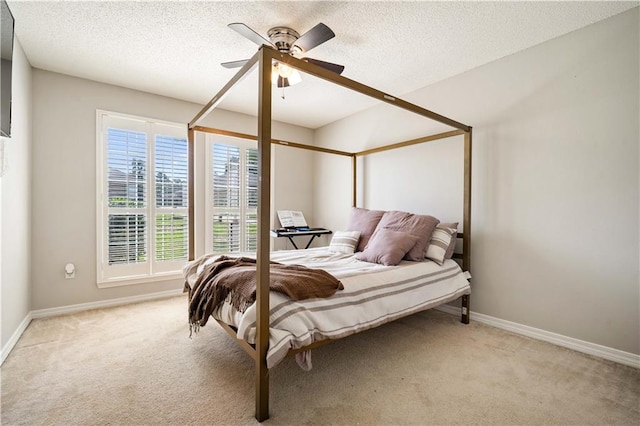 4072 Fenwick Loop, Mobile, AL 36619 - bedroom with light carpet, ceiling fan, and a textured ceiling