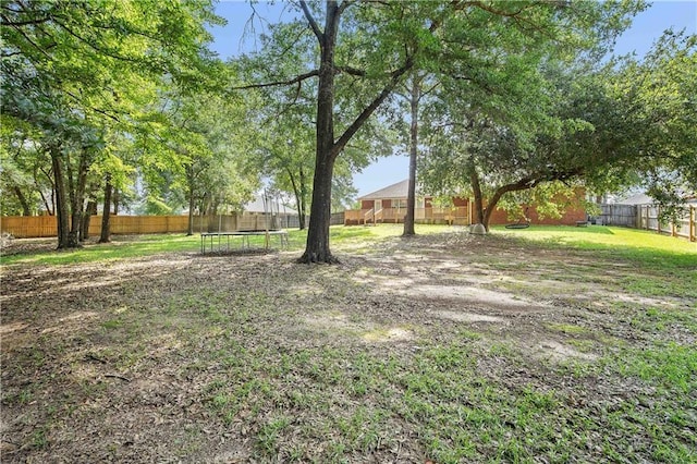 4072 Fenwick Loop, Mobile, AL 36619 - fenced backyard featuring a trampoline
