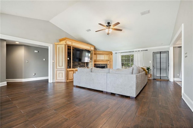 4072 Fenwick Loop, Mobile, AL 36619 - living room with lofted ceiling, ceiling fan, dark wood-style flooring, and a fireplace