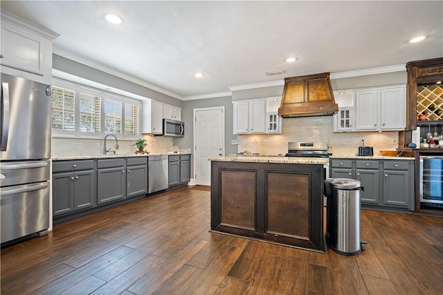 4072 Fenwick Loop, Mobile, AL 36619 - kitchen with appliances with stainless steel finishes, custom range hood, gray cabinets, beverage cooler, and backsplash