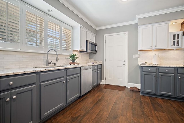 4072 Fenwick Loop, Mobile, AL 36619 - kitchen featuring stainless steel appliances, gray cabinetry, white cabinets, tasteful backsplash, and ornamental molding