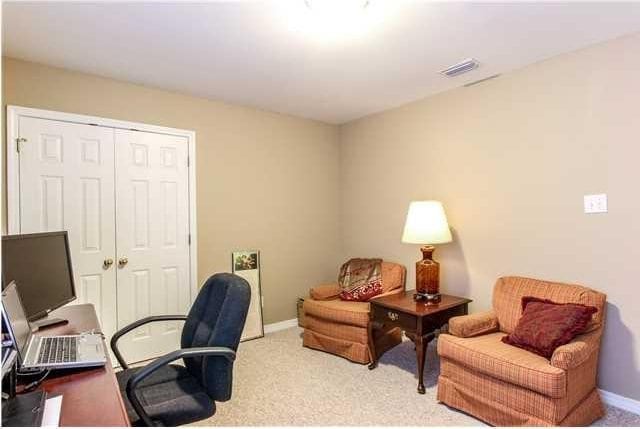 office area featuring carpet floors and baseboards