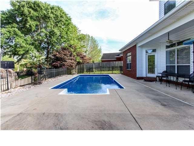 view of swimming pool with a patio area, a fenced backyard, and a fenced in pool