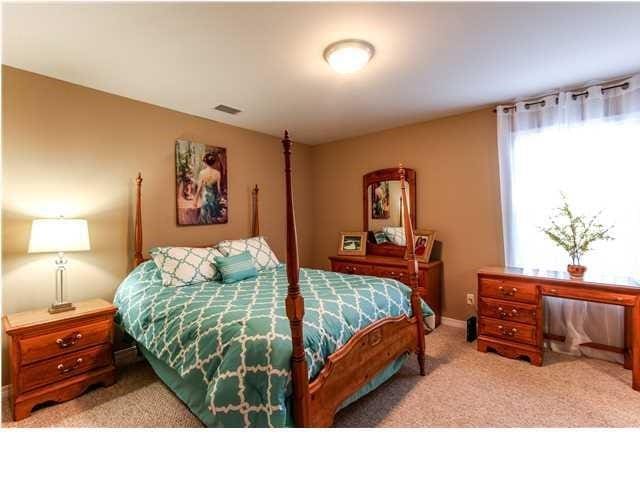 carpeted bedroom with visible vents