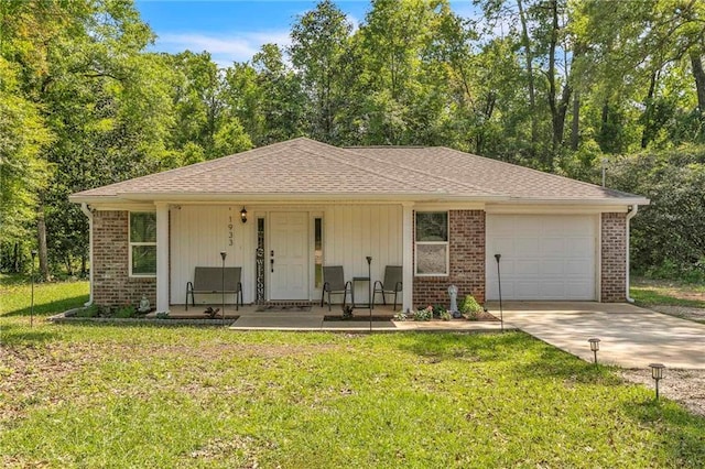 1933 Wildwood Pl, Mobile, AL 36609 - ranch-style home featuring a front lawn, brick siding, concrete driveway, an attached garage, and a porch