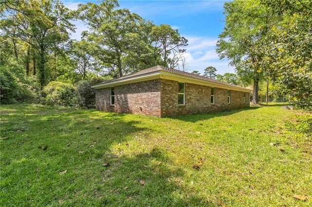 1933 Wildwood Pl, Mobile, AL 36609 - view of side of home with a yard and brick siding