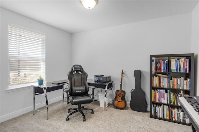 office space with carpet and baseboards