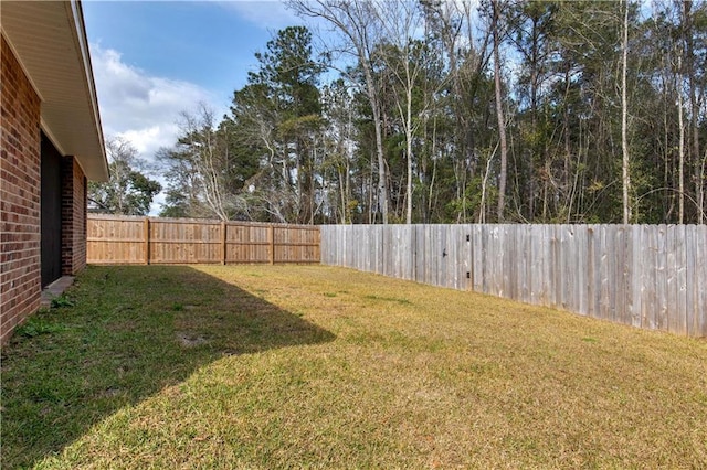 view of yard featuring a fenced backyard