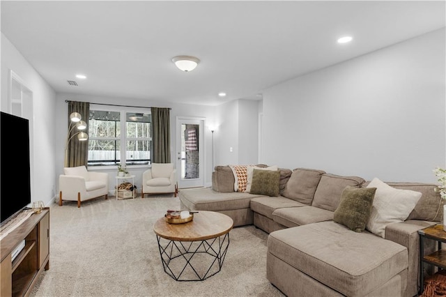 carpeted living room featuring recessed lighting and visible vents