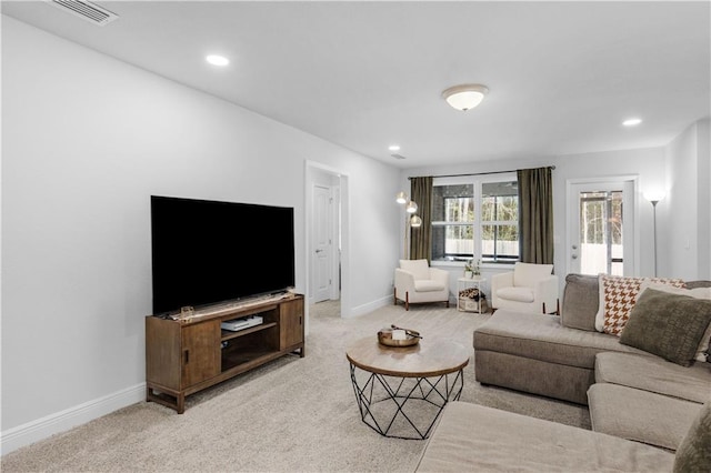 living room featuring carpet, visible vents, baseboards, and recessed lighting