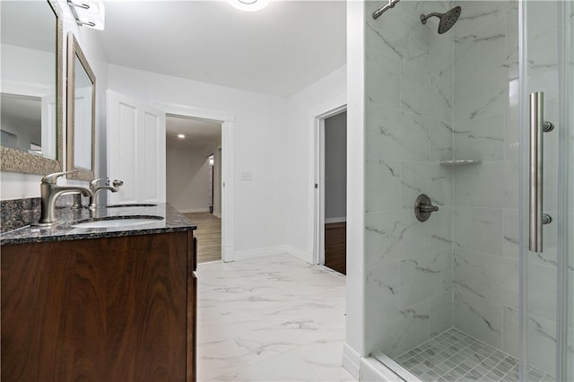 bathroom with vanity, hardwood / wood-style floors, and a shower with shower door