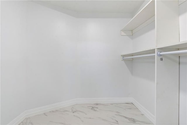 spacious closet featuring tile patterned flooring