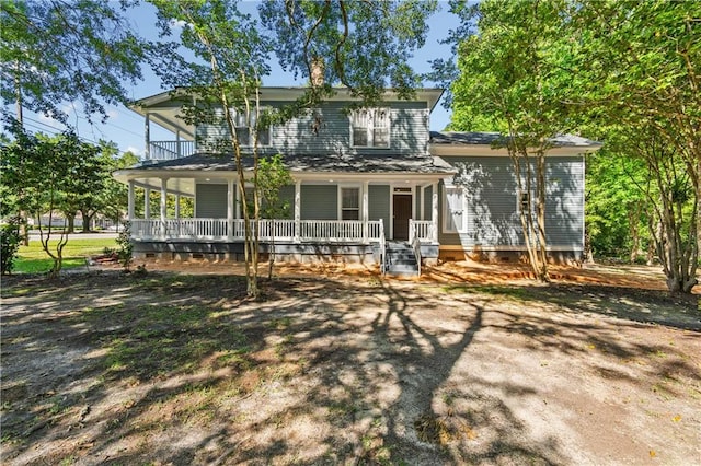 back of property featuring covered porch