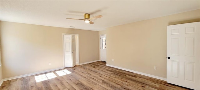 empty room featuring ceiling fan and light wood-type flooring