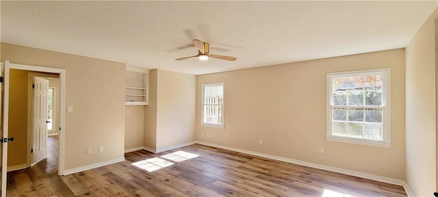 unfurnished bedroom with ceiling fan, light hardwood / wood-style flooring, and a textured ceiling