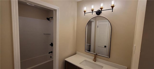 full bathroom with shower / tub combination, vanity, and toilet