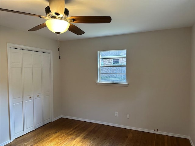 unfurnished bedroom with a closet, ceiling fan, and hardwood / wood-style flooring