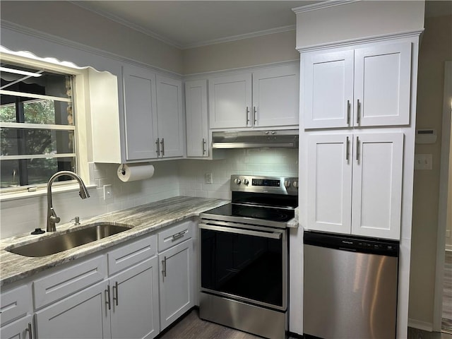 kitchen featuring light stone countertops, stainless steel appliances, sink, dark hardwood / wood-style floors, and white cabinetry