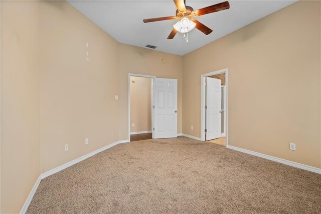 carpeted empty room featuring ceiling fan