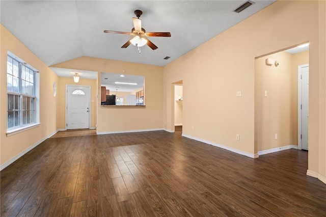 unfurnished living room featuring dark hardwood / wood-style floors, vaulted ceiling, and ceiling fan