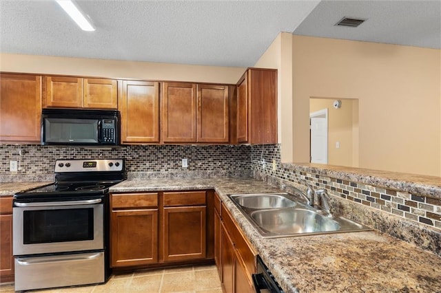 kitchen with backsplash, sink, stainless steel range with electric cooktop, and a textured ceiling