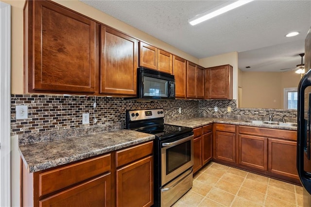 kitchen featuring decorative backsplash, a textured ceiling, ceiling fan, sink, and stainless steel range with electric cooktop