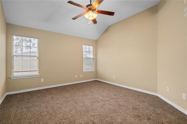 carpeted empty room featuring ceiling fan and lofted ceiling