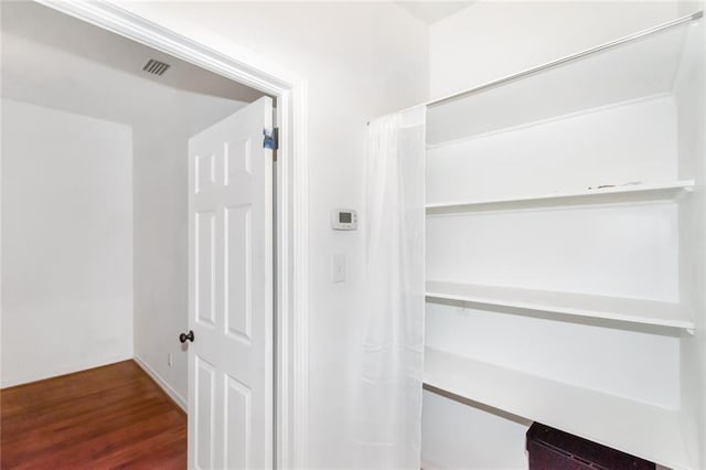 hallway featuring hardwood / wood-style flooring