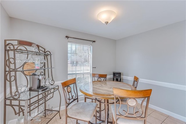 dining area with light tile patterned floors