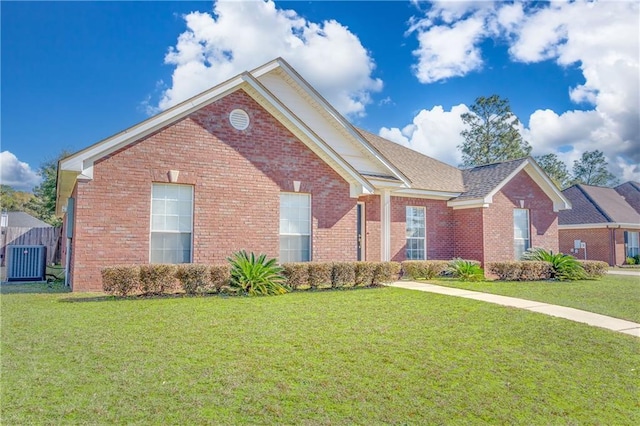 front of property featuring cooling unit and a front yard