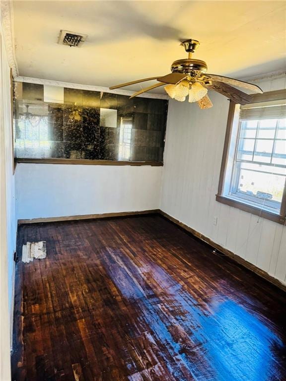 unfurnished room with hardwood / wood-style flooring and ceiling fan