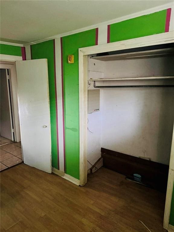 unfurnished bedroom featuring hardwood / wood-style flooring