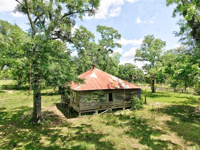 view of side of property with metal roof