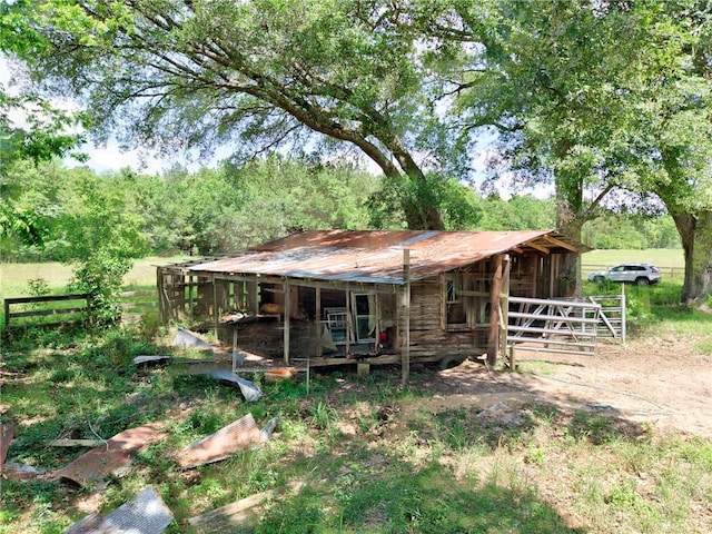 view of front of home featuring an exterior structure and an outdoor structure