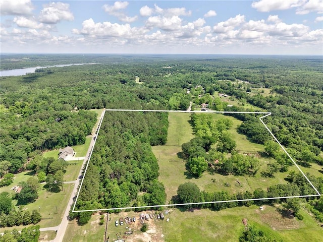 aerial overview of property's location featuring a heavily wooded area and property boundaries highlighted