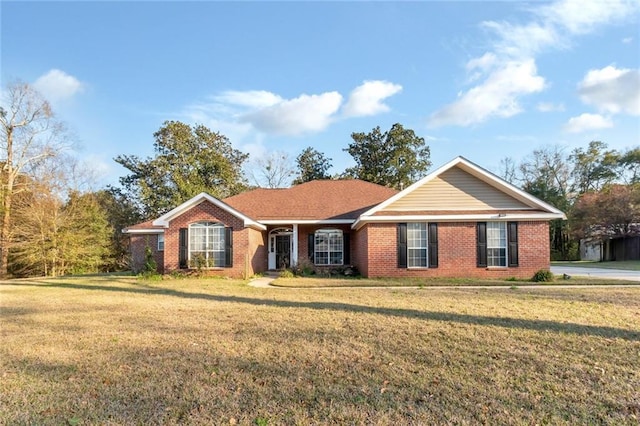 ranch-style house with brick siding and a front lawn