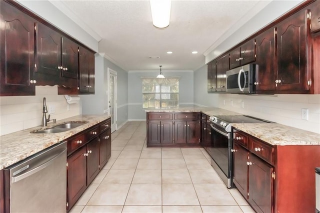 kitchen featuring light tile patterned floors, decorative backsplash, appliances with stainless steel finishes, ornamental molding, and a sink