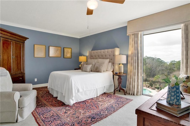 bedroom with a ceiling fan, carpet, baseboards, ornamental molding, and access to exterior