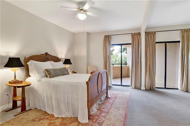 carpeted bedroom featuring access to outside, baseboards, and ceiling fan