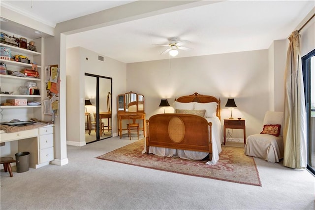 bedroom with carpet flooring, ceiling fan, baseboards, and visible vents