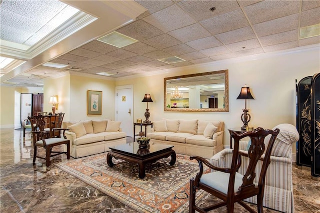 living room with marble finish floor, crown molding, and baseboards