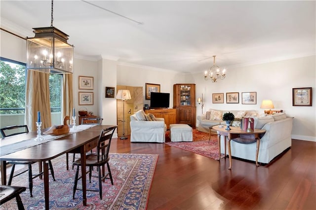 dining space featuring ornamental molding, baseboards, dark wood-style flooring, and a chandelier