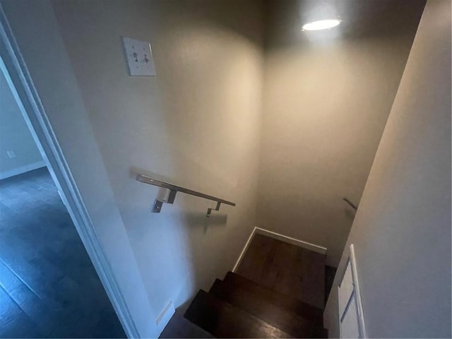 stairway featuring hardwood / wood-style flooring