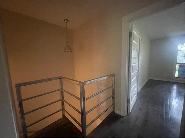 2901 Grant St Unit 2703, Mobile, AL 36606 - corridor featuring dark wood finished floors, baseboards, and an upstairs landing