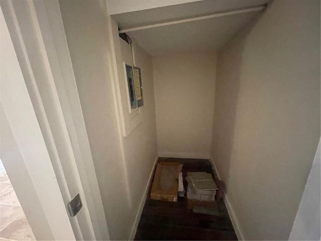 stairs featuring tile patterned flooring and electric panel